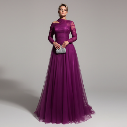 Woman wearing a long purple evening gown against a gray background