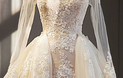 Close-up of a lace wedding dress with a soft focus background