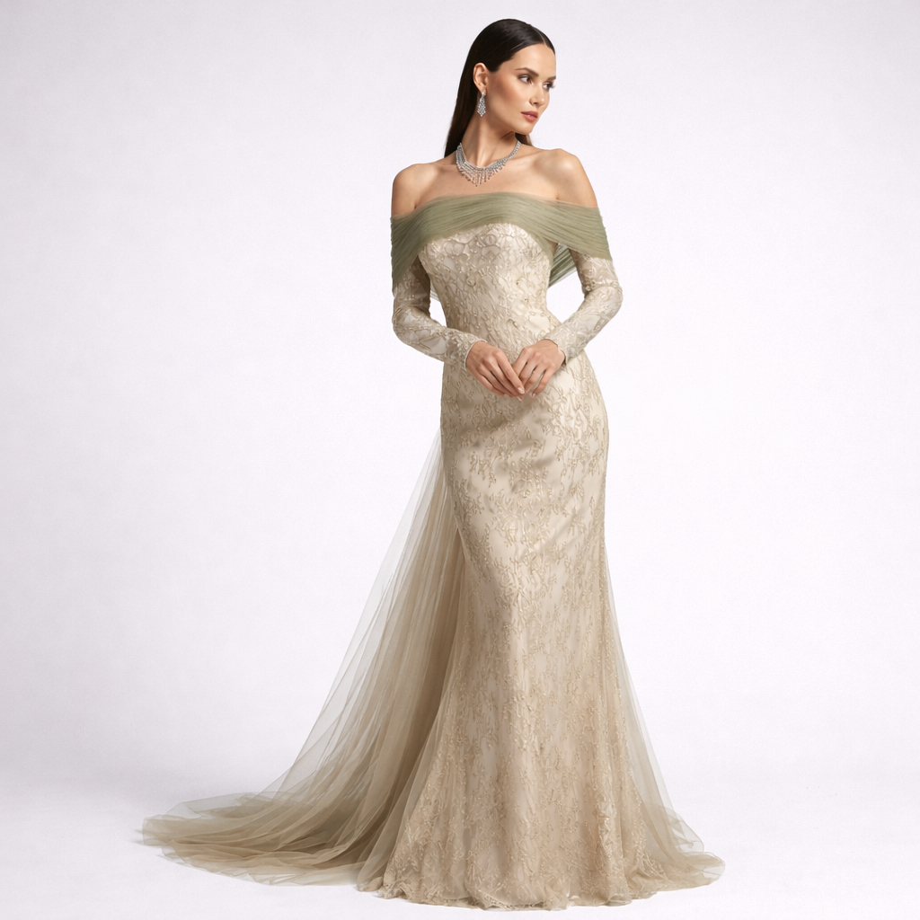 Woman wearing a long, elegant dress with a green bodice on a white background