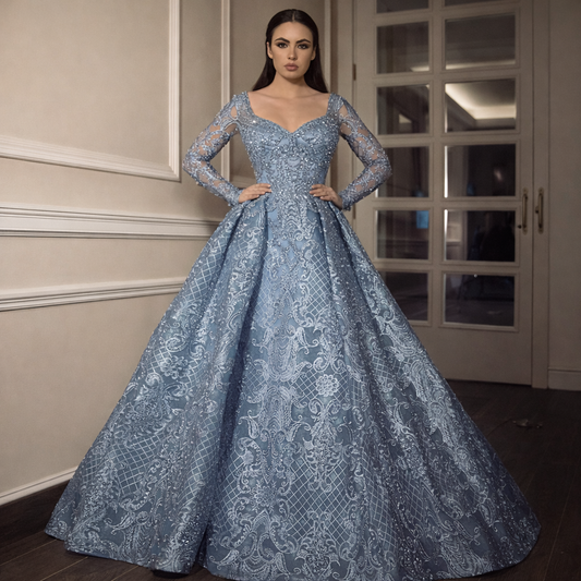 Woman wearing a blue lace evening gown in an indoor setting