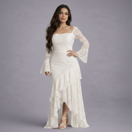 Woman wearing a white lace dress against a gray background