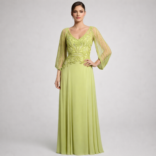 Woman wearing a green evening gown with lace sleeves on a white background