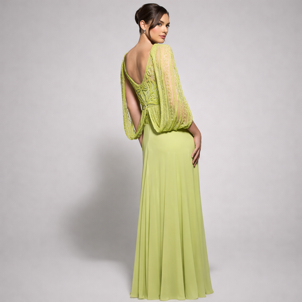 Woman wearing a light green evening gown with a sheer overlay on a gray background